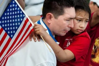 immigrant family with flag