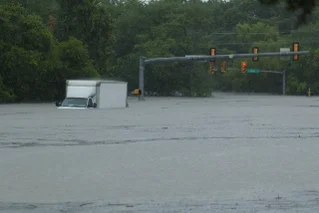 A van submerged in rising Texas flood waters