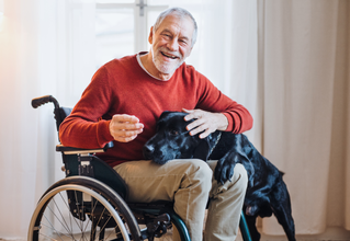 elderly disabled man with dog